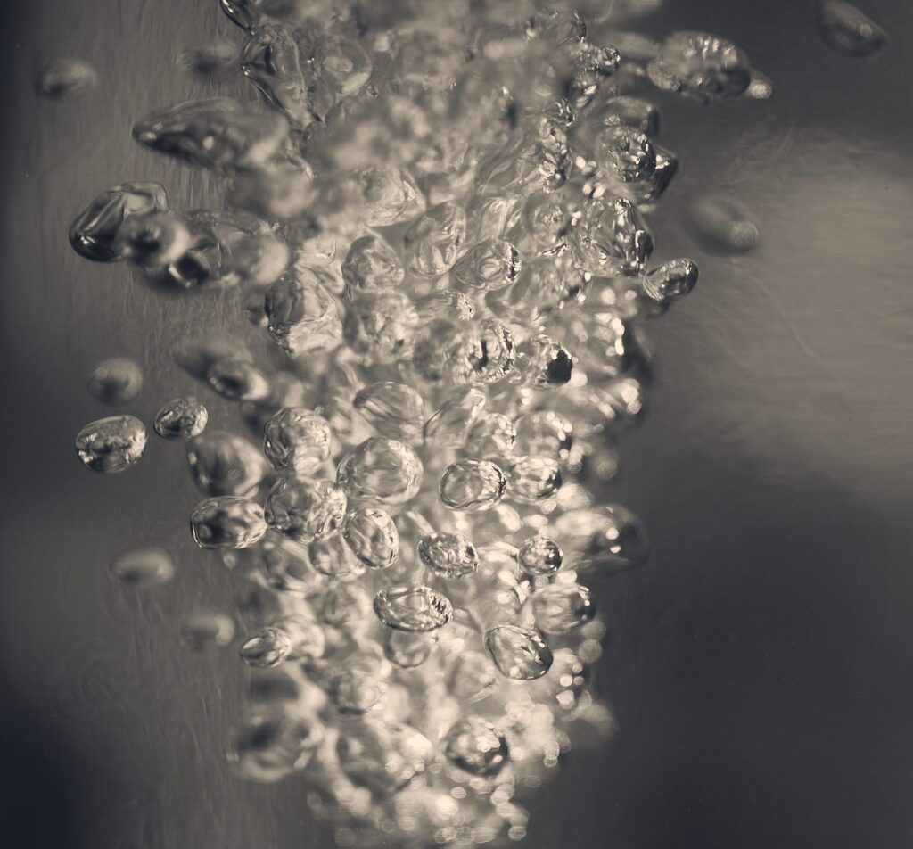 Frozen bubbles clustered on a grey surface