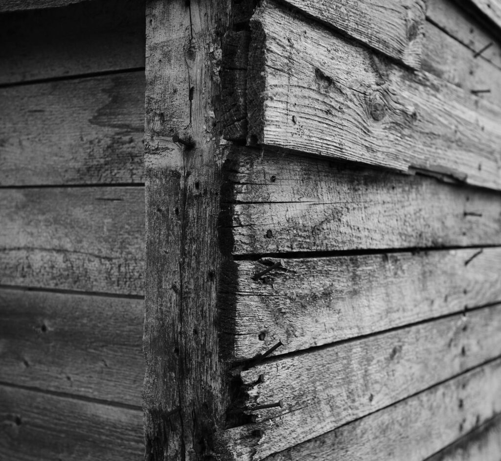Weathered wood siding at a corner