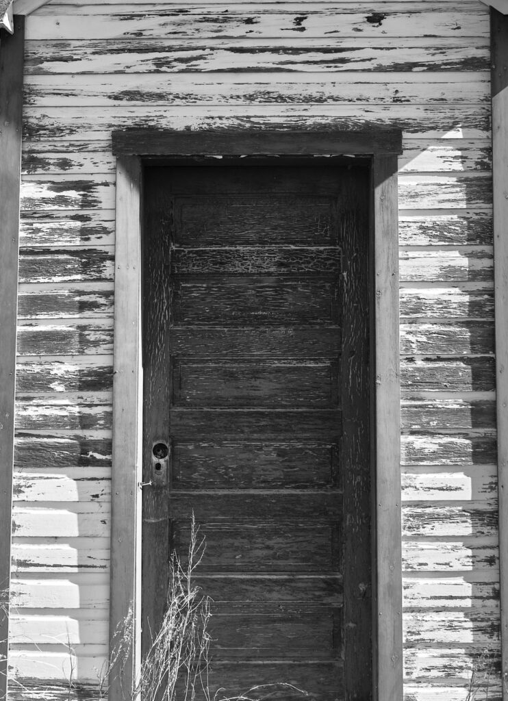An old wooden door with peeling paint