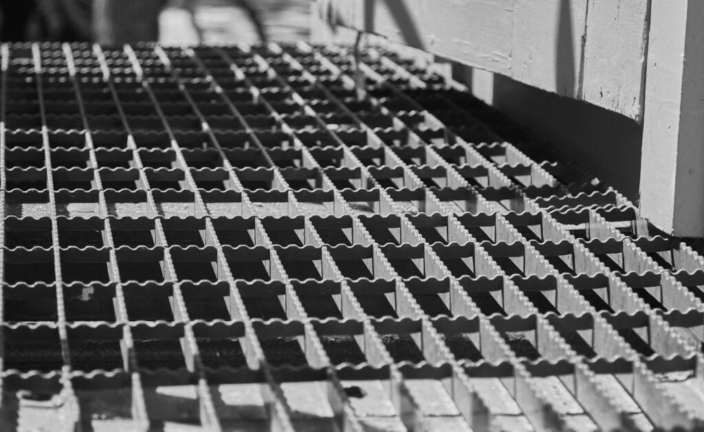 A metal grate in sunlight