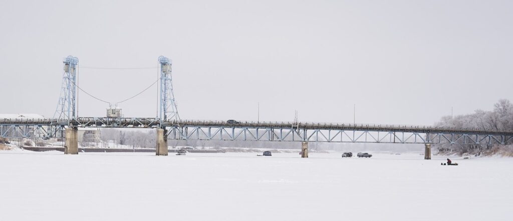 Lift bridge crossing a frozen river in winter