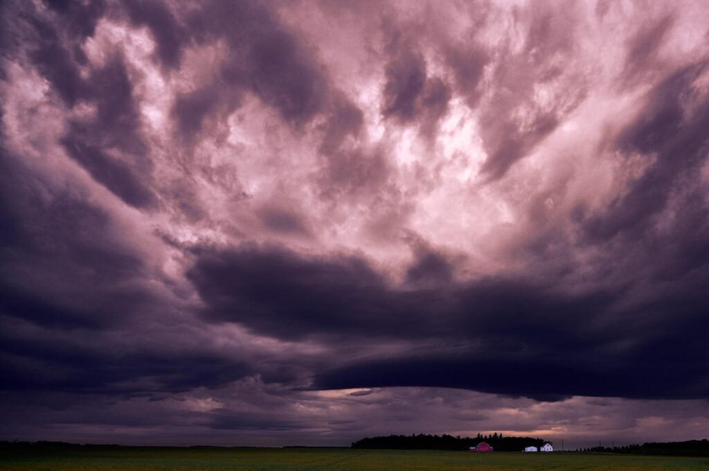 Pink and purple storm clouds churning overhead