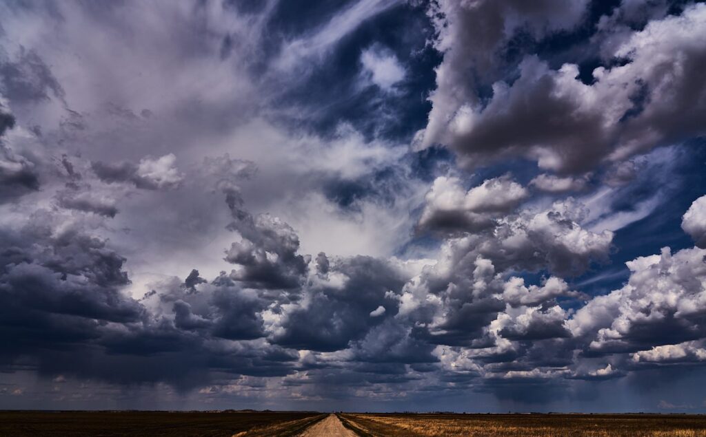 Textured storm clouds above a road